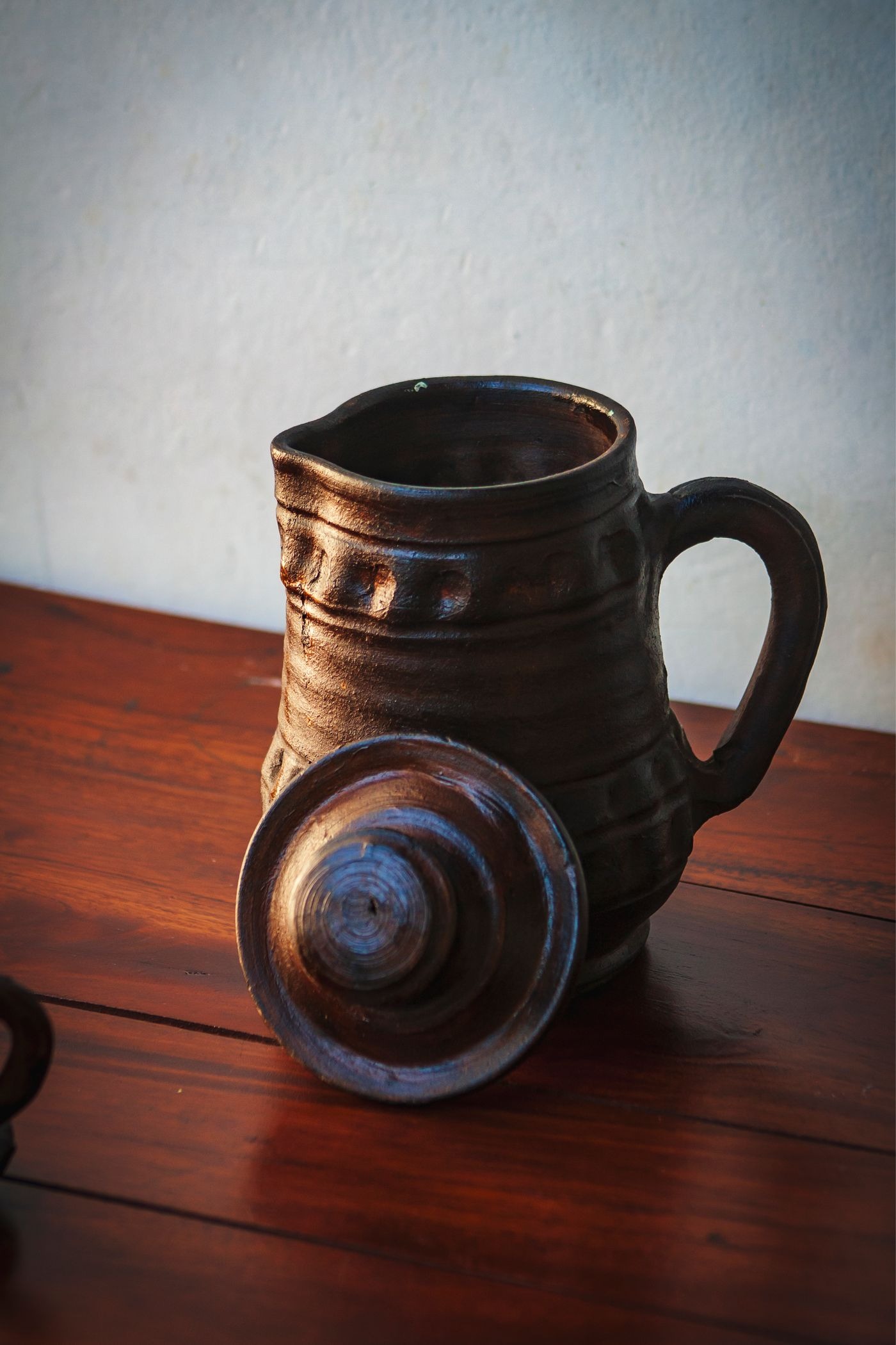 Stock photo of a pitcher on a table, not a listed product