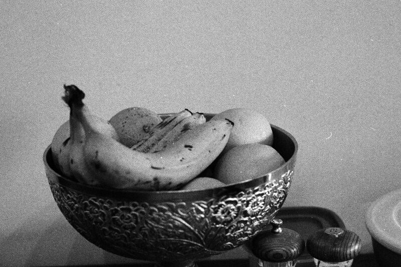 A bowl of bananas and other fruit