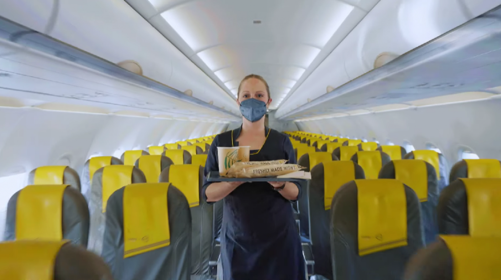 stewardess with food inside the plane
