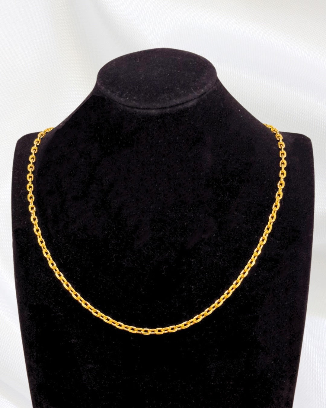 Thai Gold 24K round anchor chain on a display bust