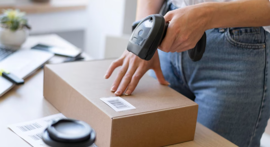 close up hand holding scanner
