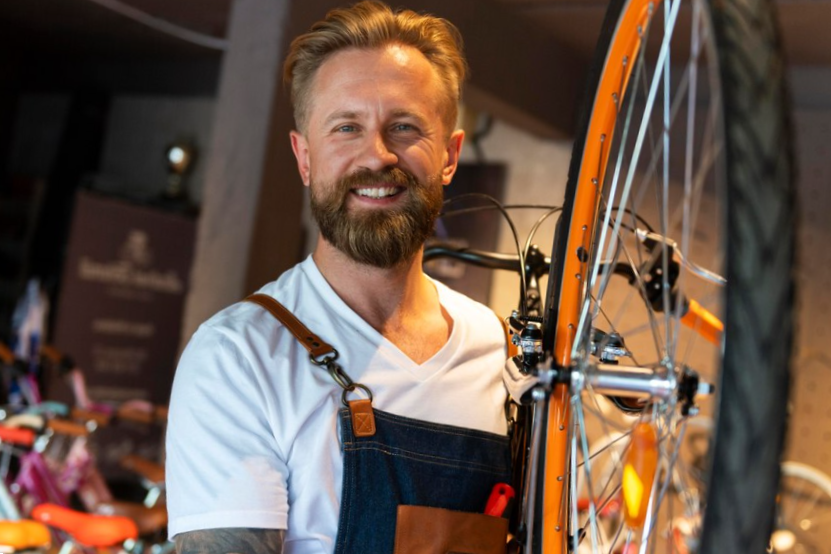 close up on young businessman in bike shop
