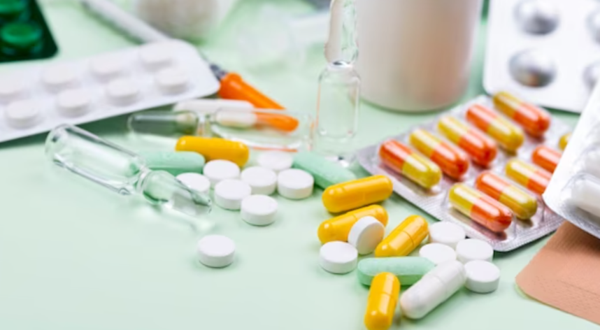 High angle arrangement of medical objects on green background