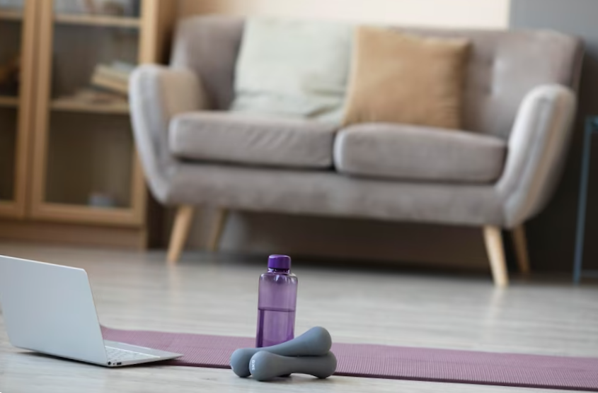 interior design with yoga mat and dumbbells
