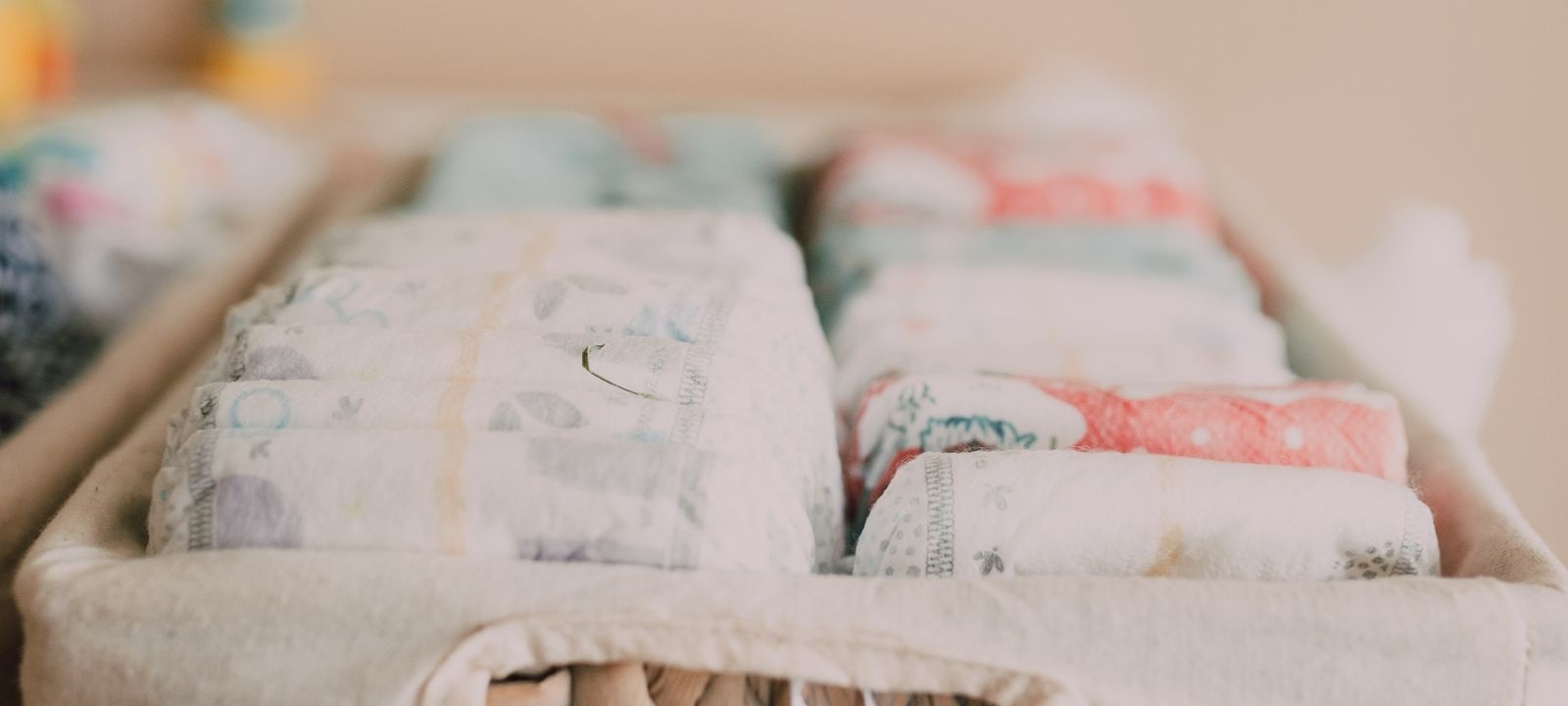 Cropped stock photograph of diapers in a basket, not a listed organizer