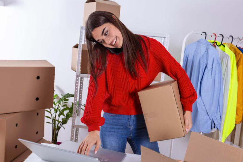 Young woman owener of small business packing product in boxes preparing it for delivery women packing package with her products that she selling online