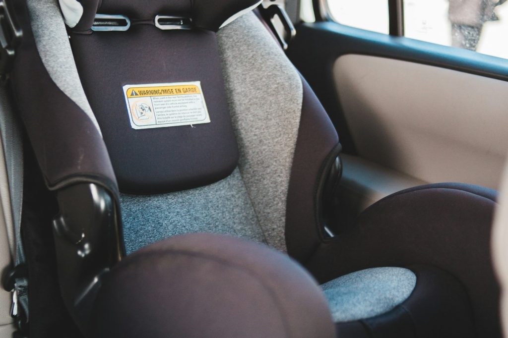 Unoccupied child car seat in a vehicle; refer to the manual for installation