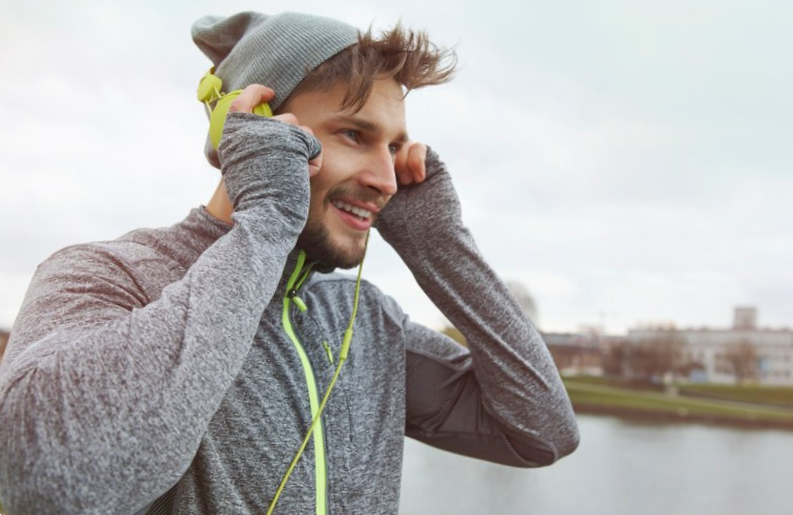man listening to music while playing sports